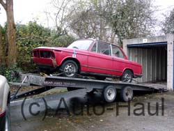 BMW 2002 unfinished project being loaded to be delivered to new owner.